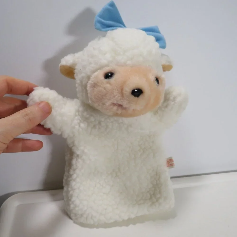vintage sheep puppet with blue bow sewn on, lined inside thick heavy fur fabric